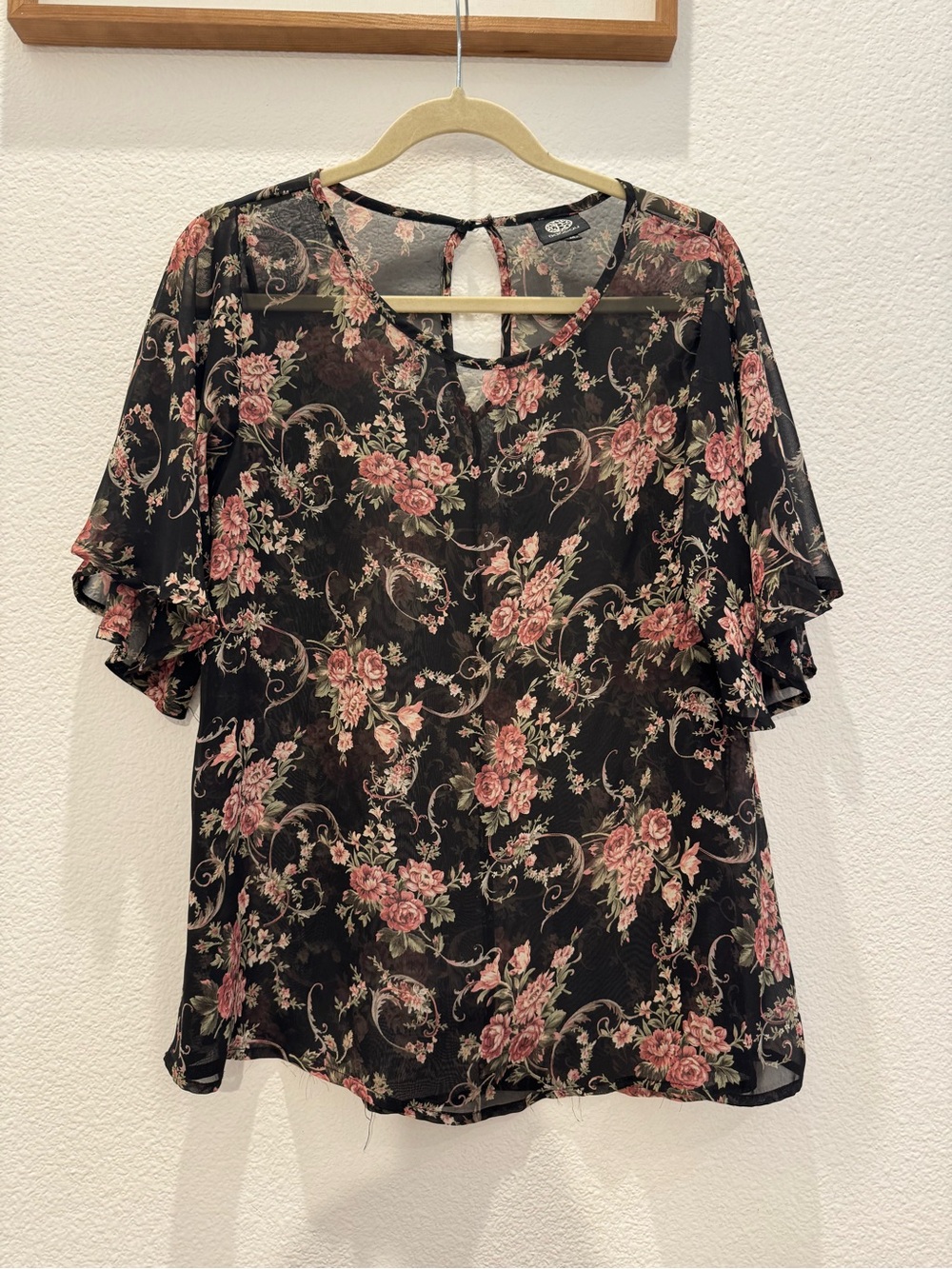 Bobeau sheer floral top w/ botanical print on a black base & flutter sleeves
